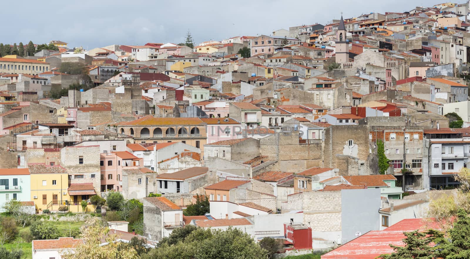 skyline with old houses of the village Sennori seen from the upper promenade on  Sardinia, Italiy