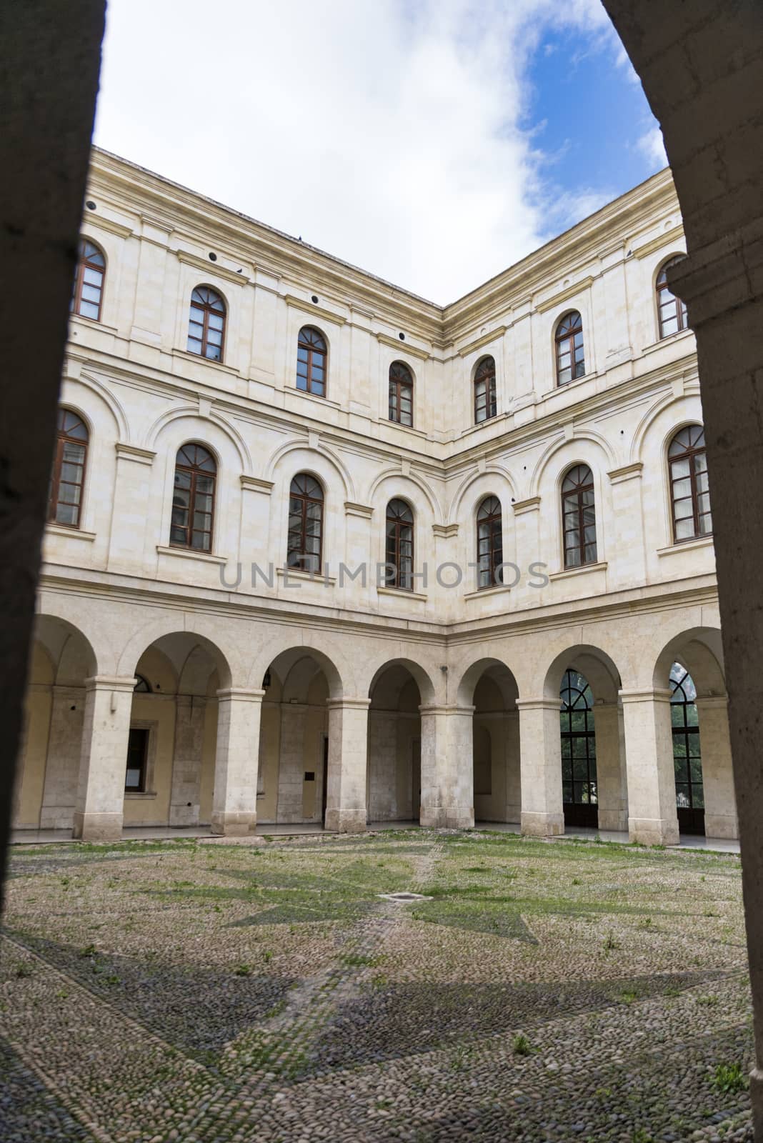 Sassari,Italy,12-april-2018:people are at the entrance of the Palazzo Ducale in Sassari on the italian island of sardegna, this is used as townhall, sassari is one of the biggest cities of sardinia