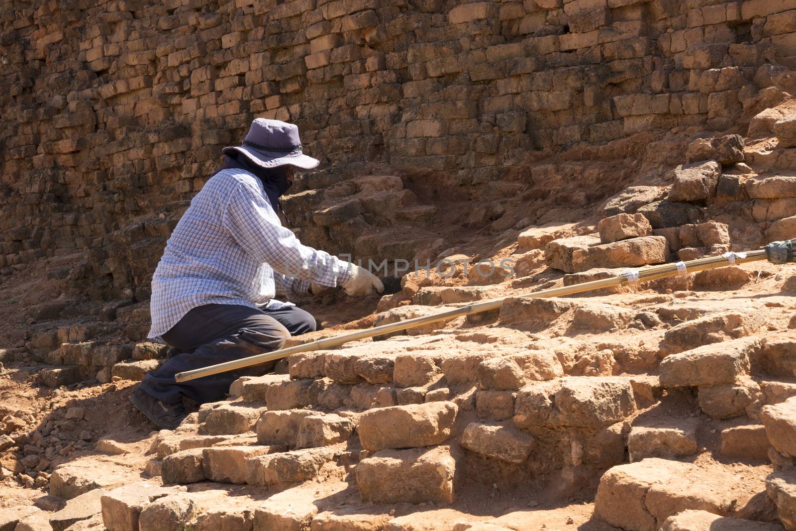 SRITHEPH,THAILAND JUNE 09, 2017 - Workers are renovating the ancient city by breaking old brick out to make the city look more beautiful.