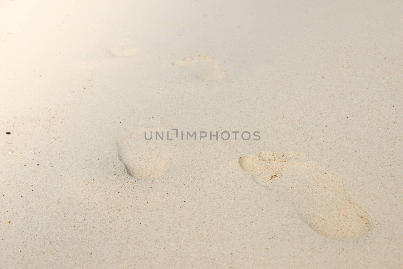 Human footprint on sand. by sakchaineung