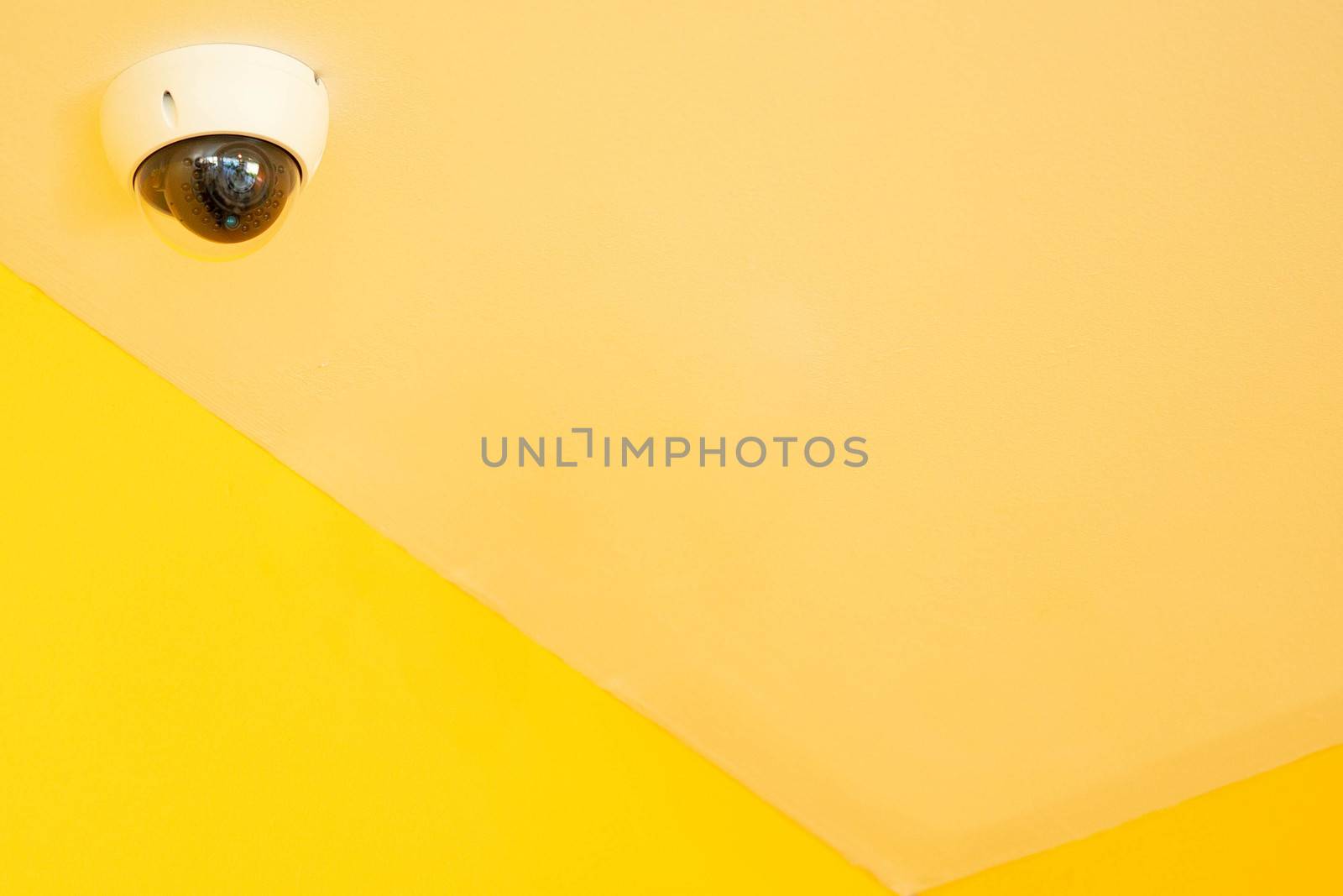 closed circuit camera or CCTVBackground Yellow. by sakchaineung