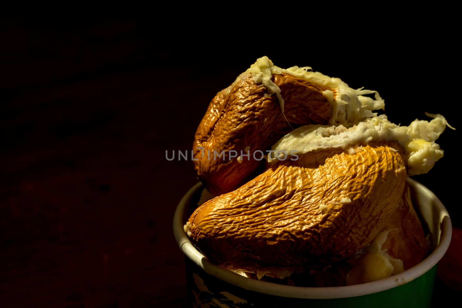 Close up Durian seeds after eating meat. Black background makes  by sakchaineung