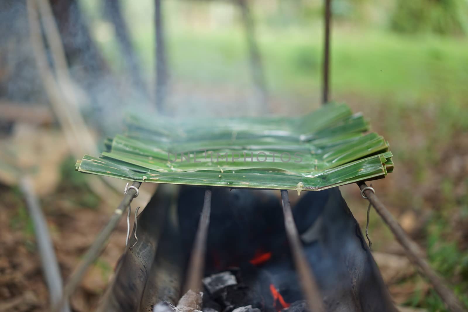 sticky rice with coconut in palm leaf. Traditional Thai desserts by sakchaineung