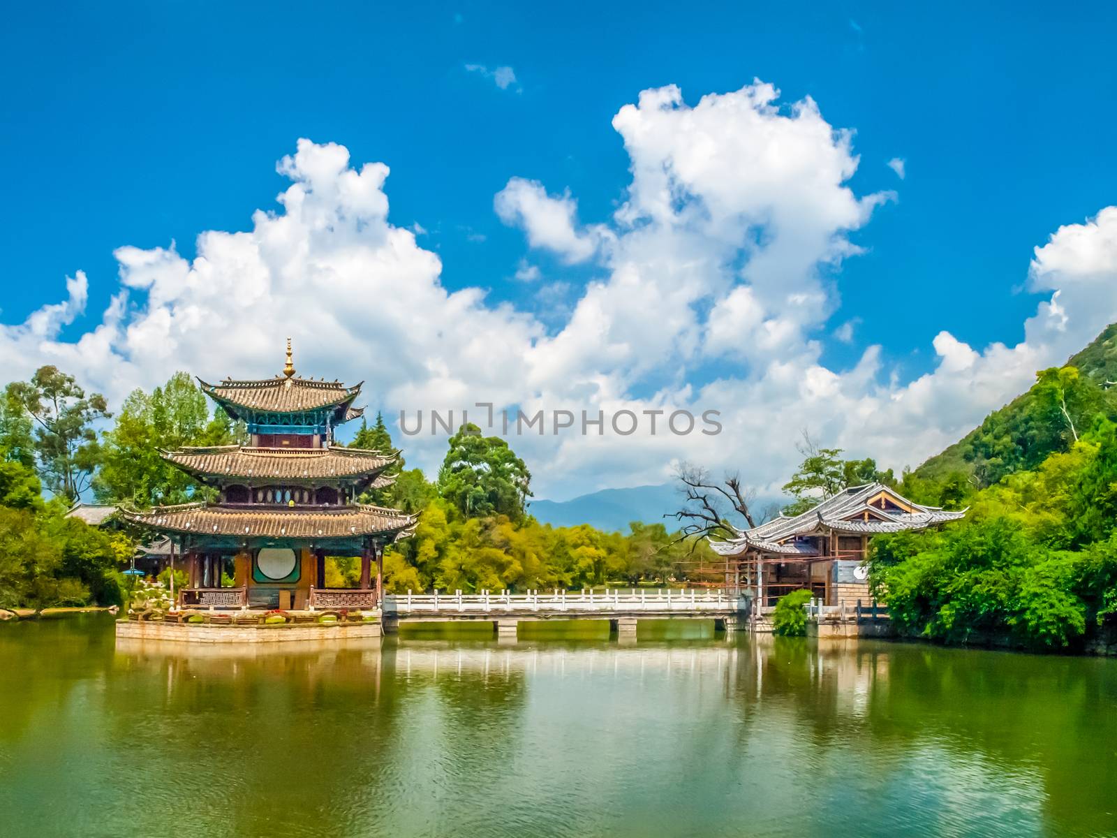 Black Dragon Pool and Moon Embracing Pavilion on sunny day, Lijiang, Yunnan Province, China by pyty