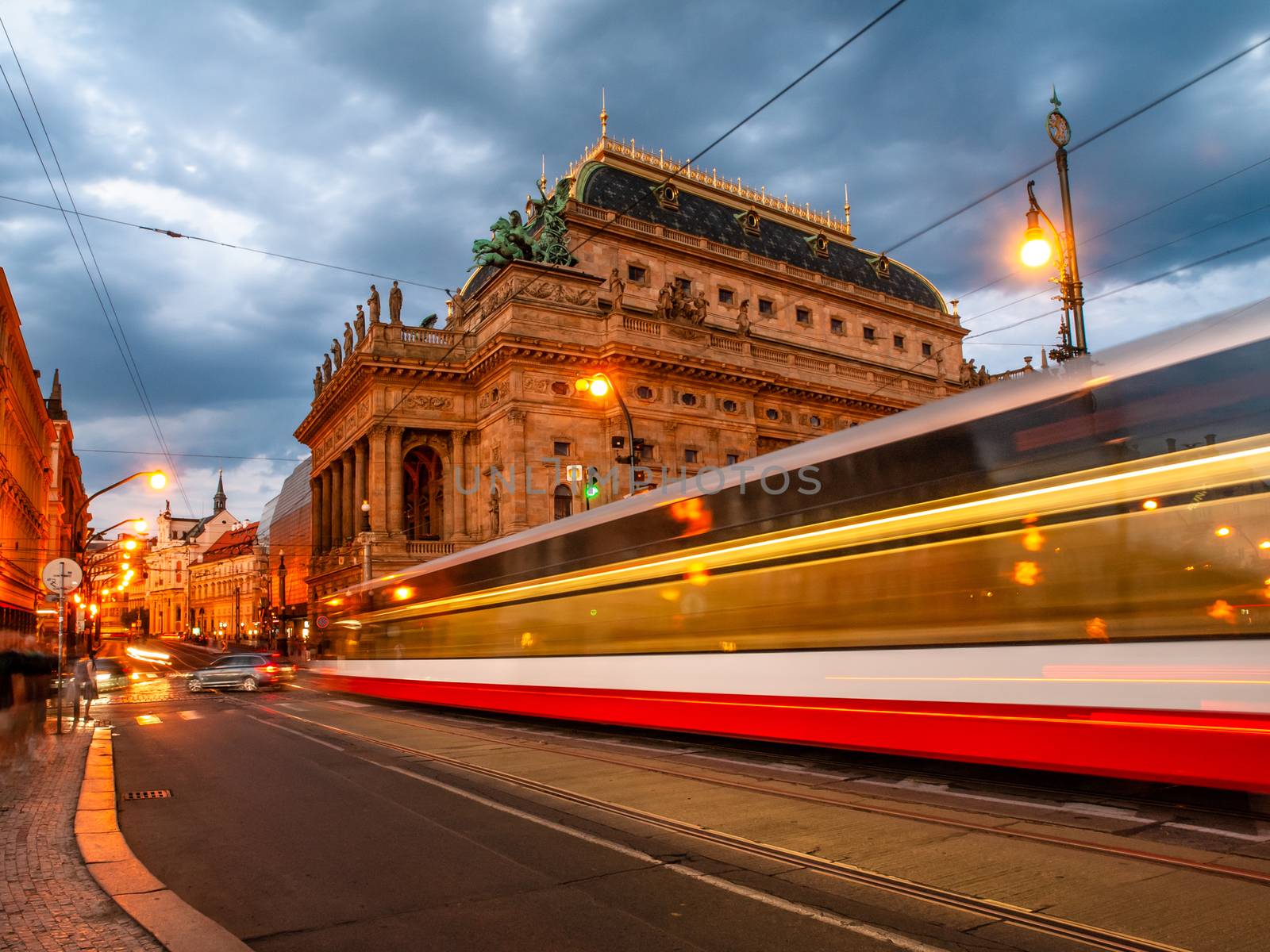 Evening at National Theater and blurred tram on the bridge, Prague, Czech Republic. Long exposure shot by pyty