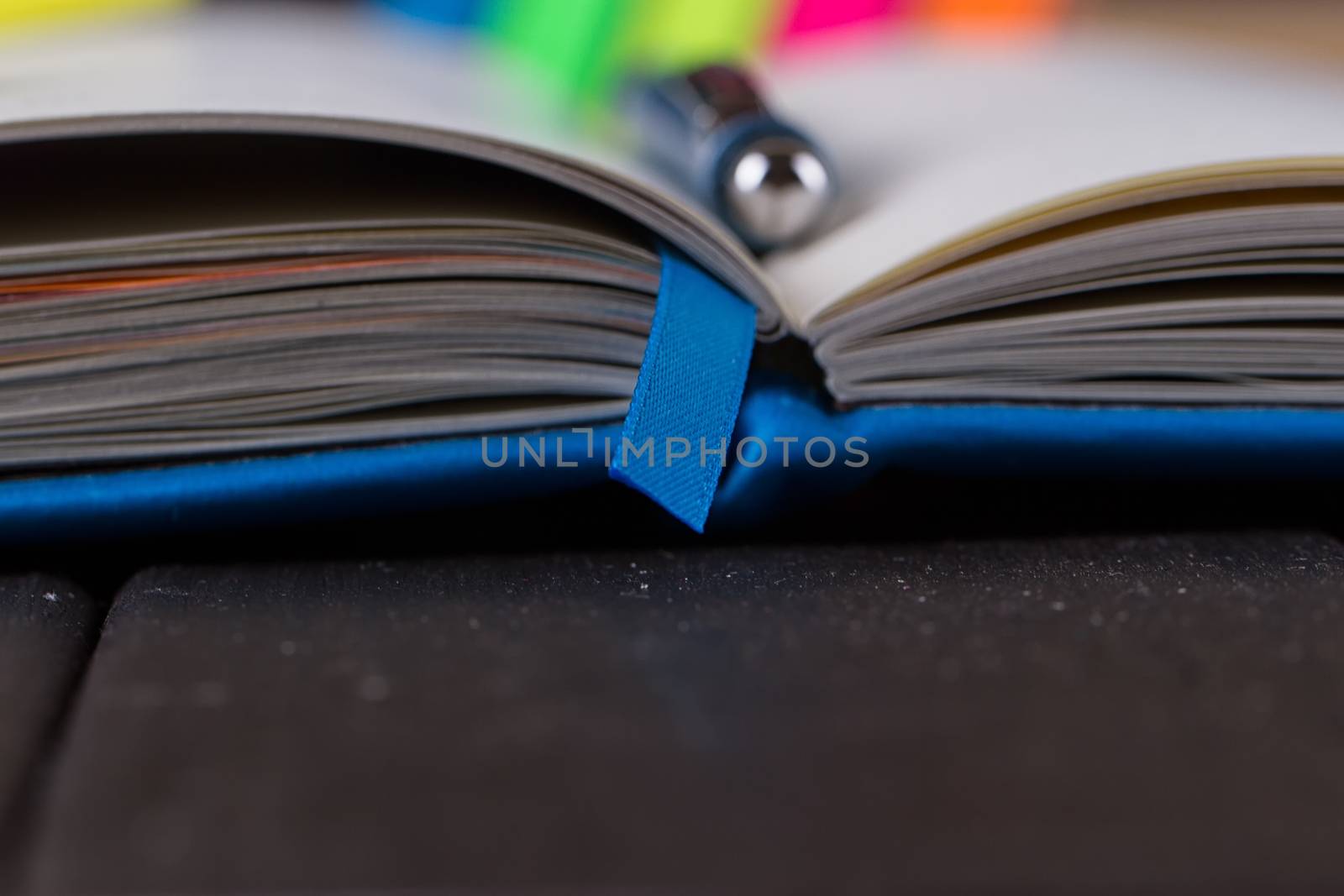 Planning your day, A day blank day planner with a blue pen