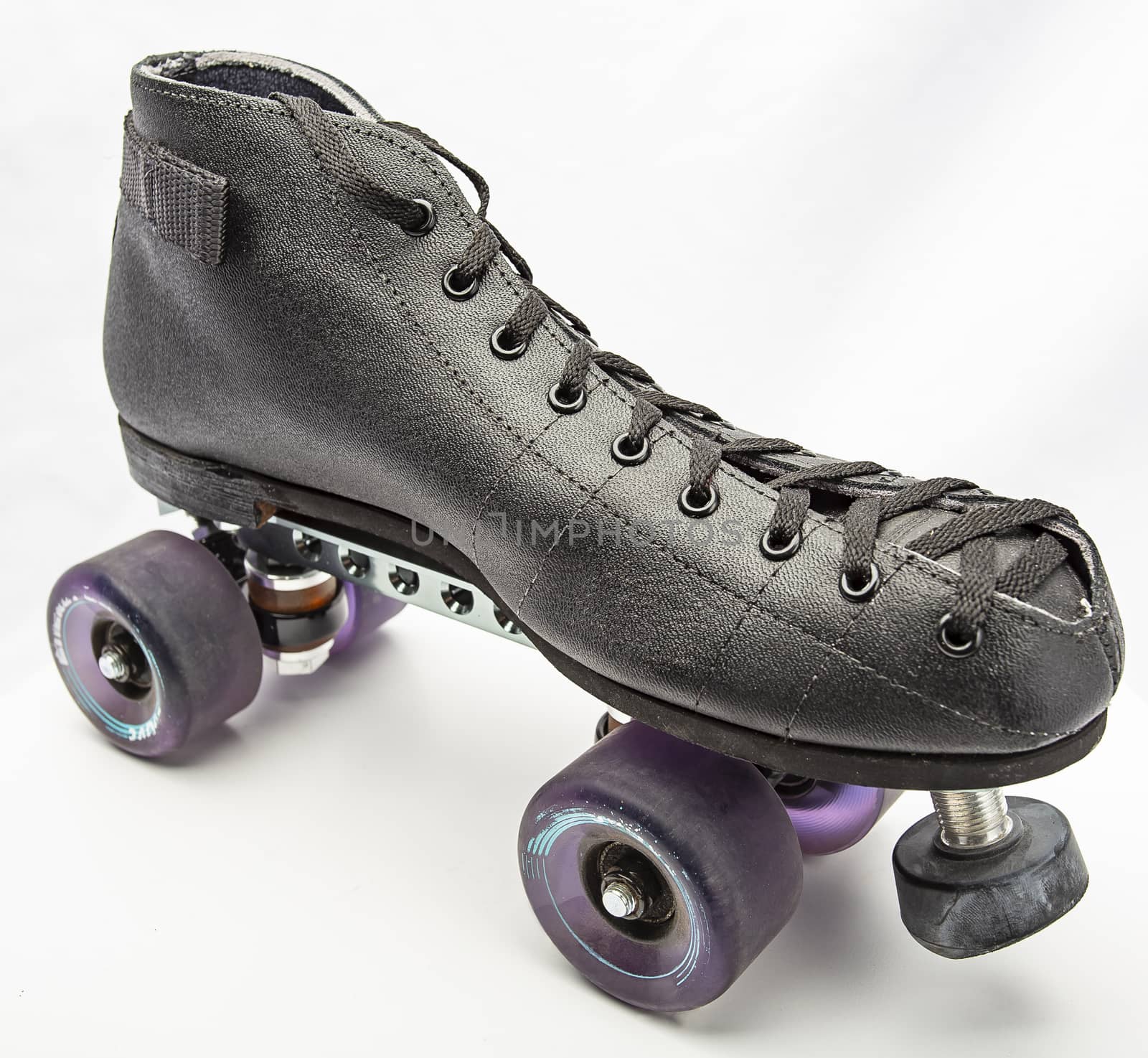 Black boot roller skate with purple wheels