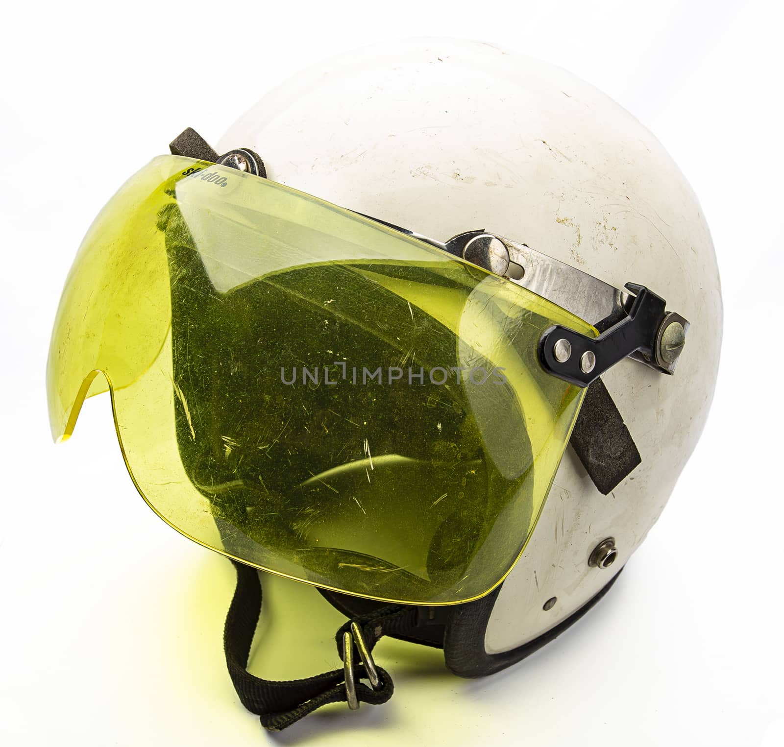 Old white bike helmet with yellow visor