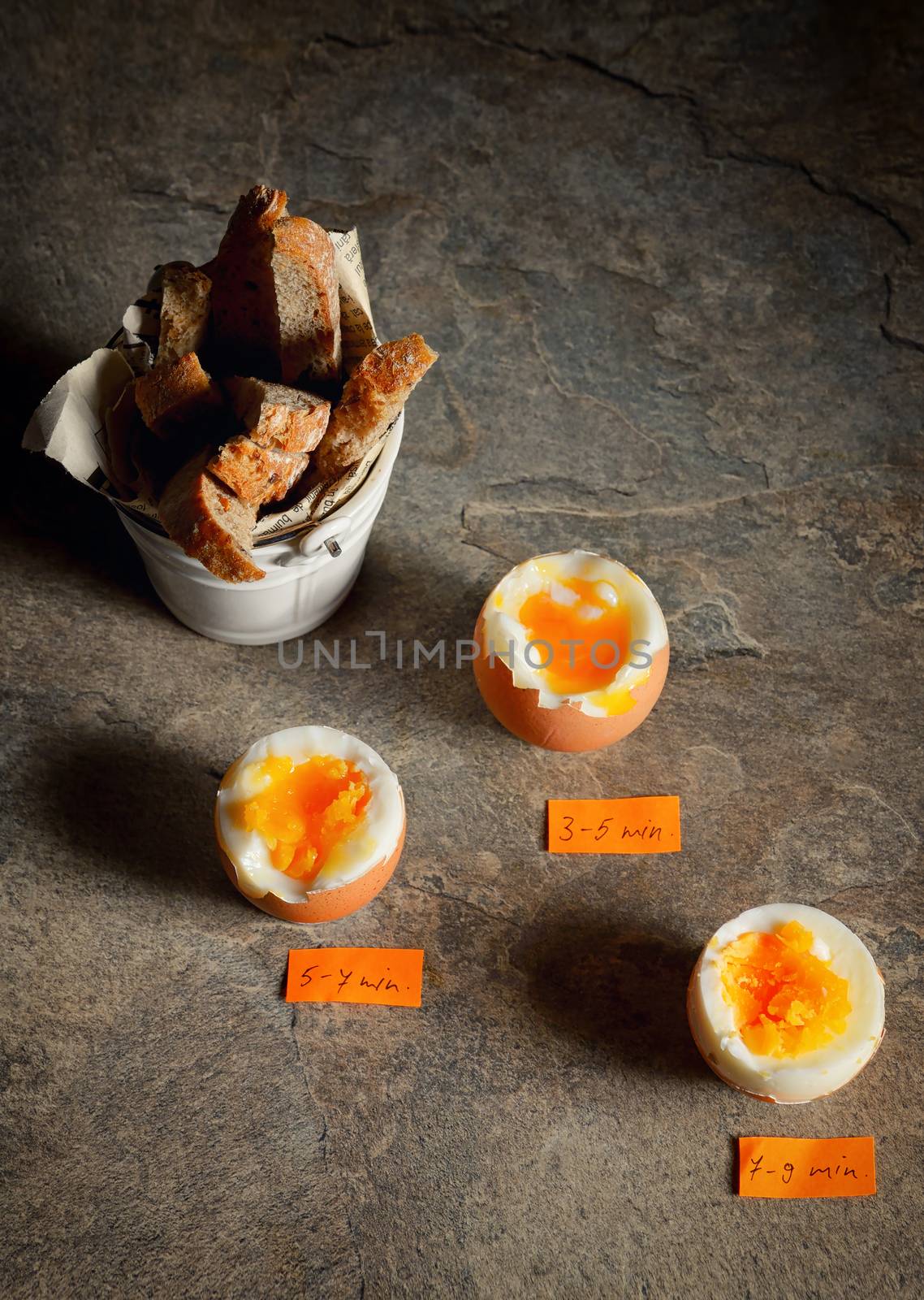 Boiled eggs by the minute on stone table