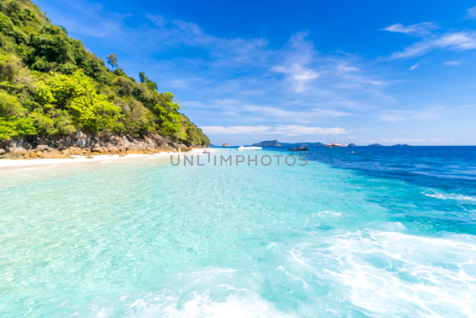 Tropical white sand beach at snoekel point from speed boat at andaman sea indian ocean Myanmar and Thailand.