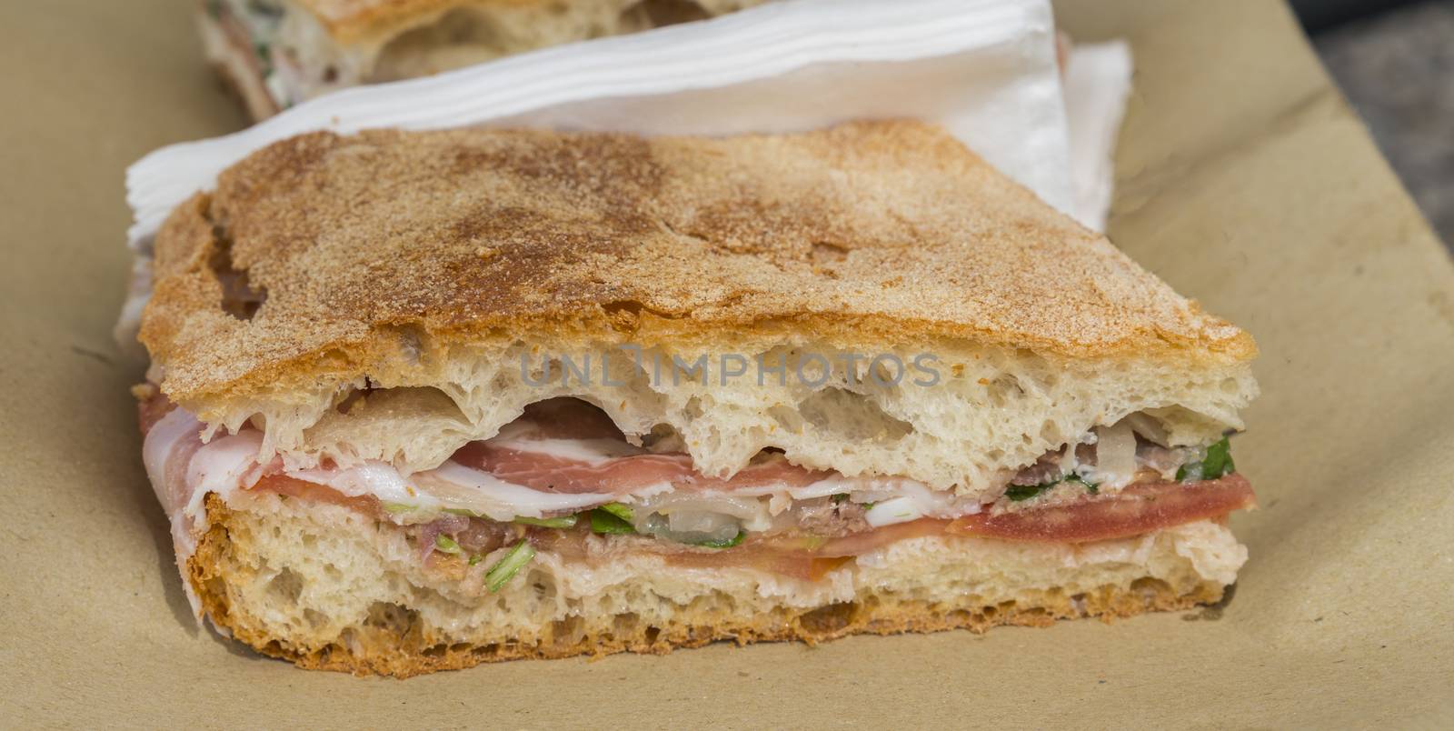 traditional Italian foccacia stuffing with cheese ham herbs and tomato