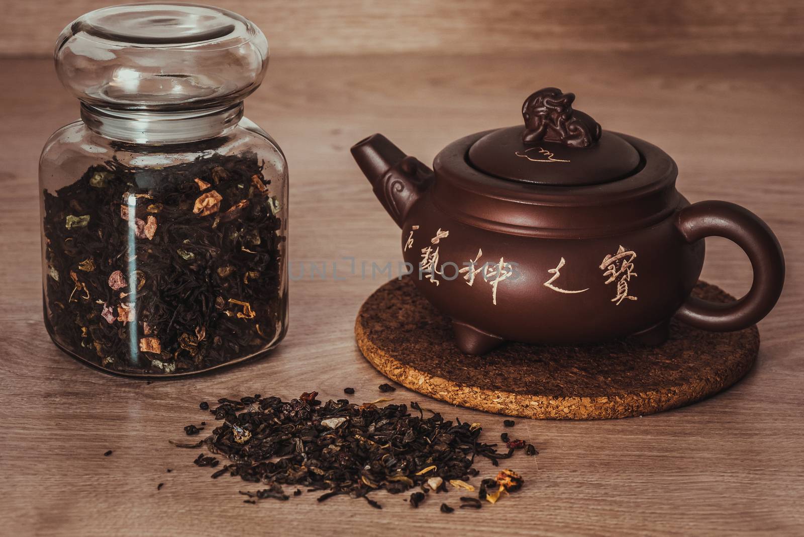Asian teapot and jar with tea by Seva_blsv