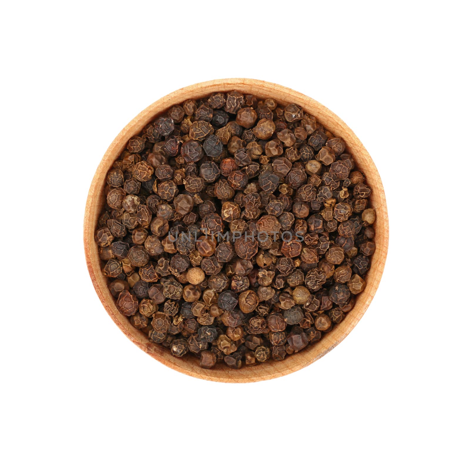 Close up one wooden bowl full of black pepper peppercorns isolated on white background, elevated top view, directly above