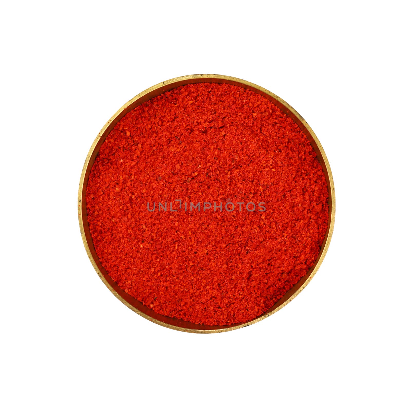 Close up one bronze metal bowl full of red chili pepper or paprika powder isolated on white background, elevated top view, directly above