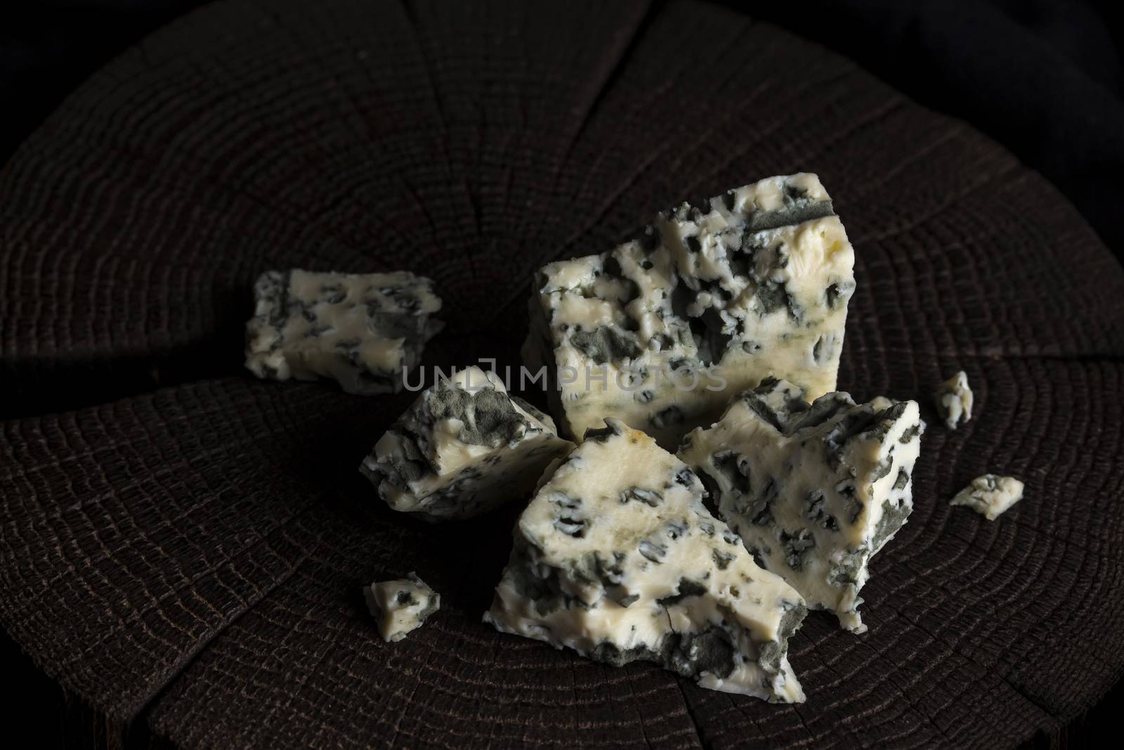Danish blue cheese on black wooden background, with copy space by xamtiw