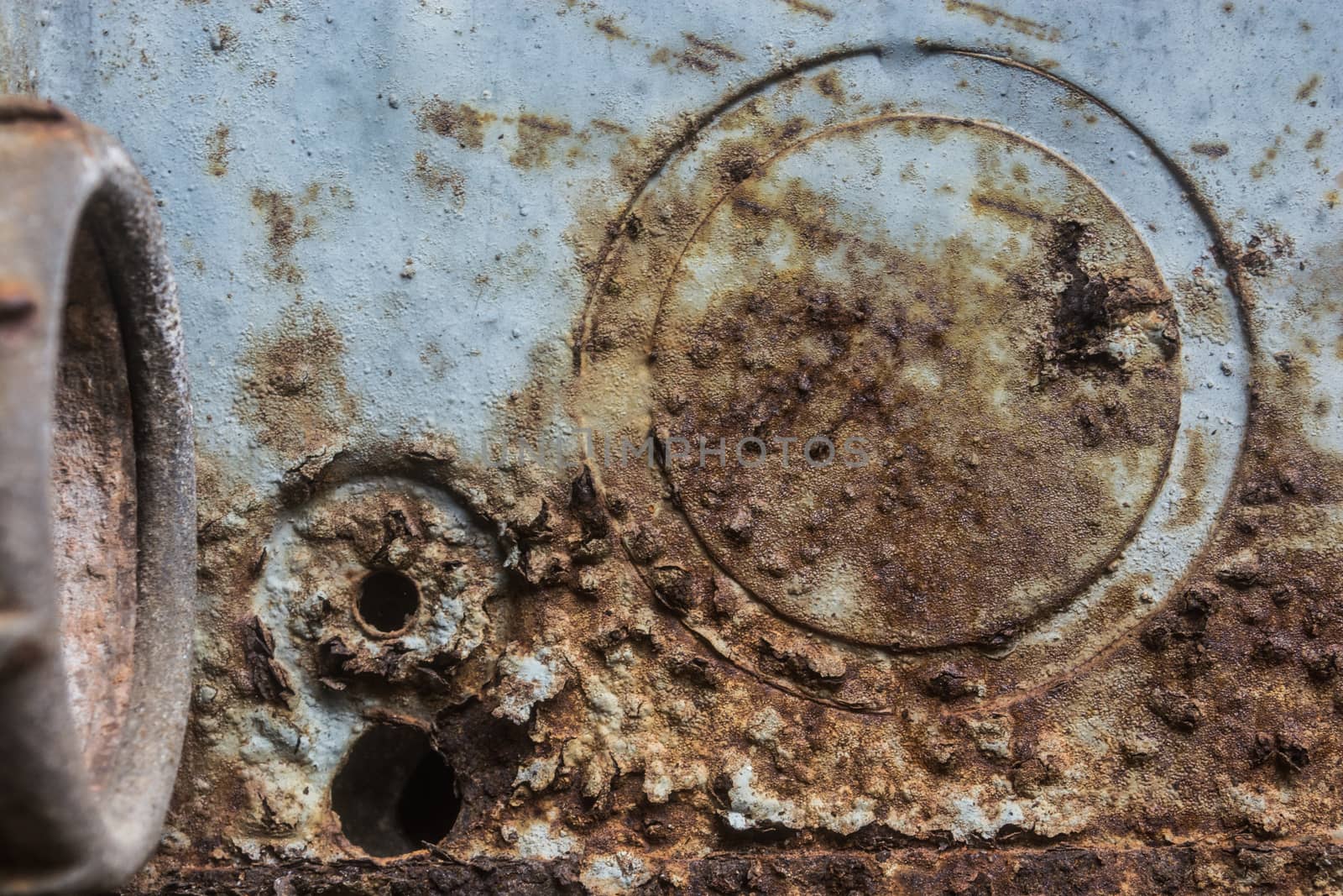 Corroded iron textue with holes.