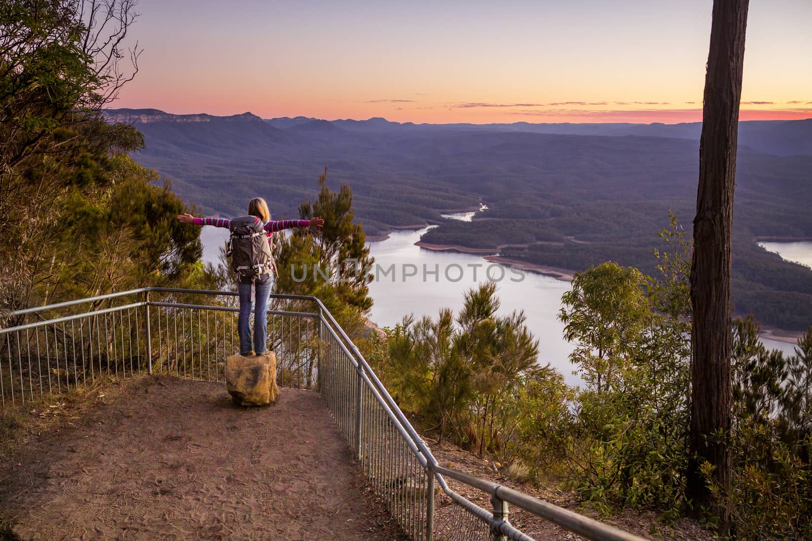 Hiker enjoying the river valley views from a lookout by lovleah