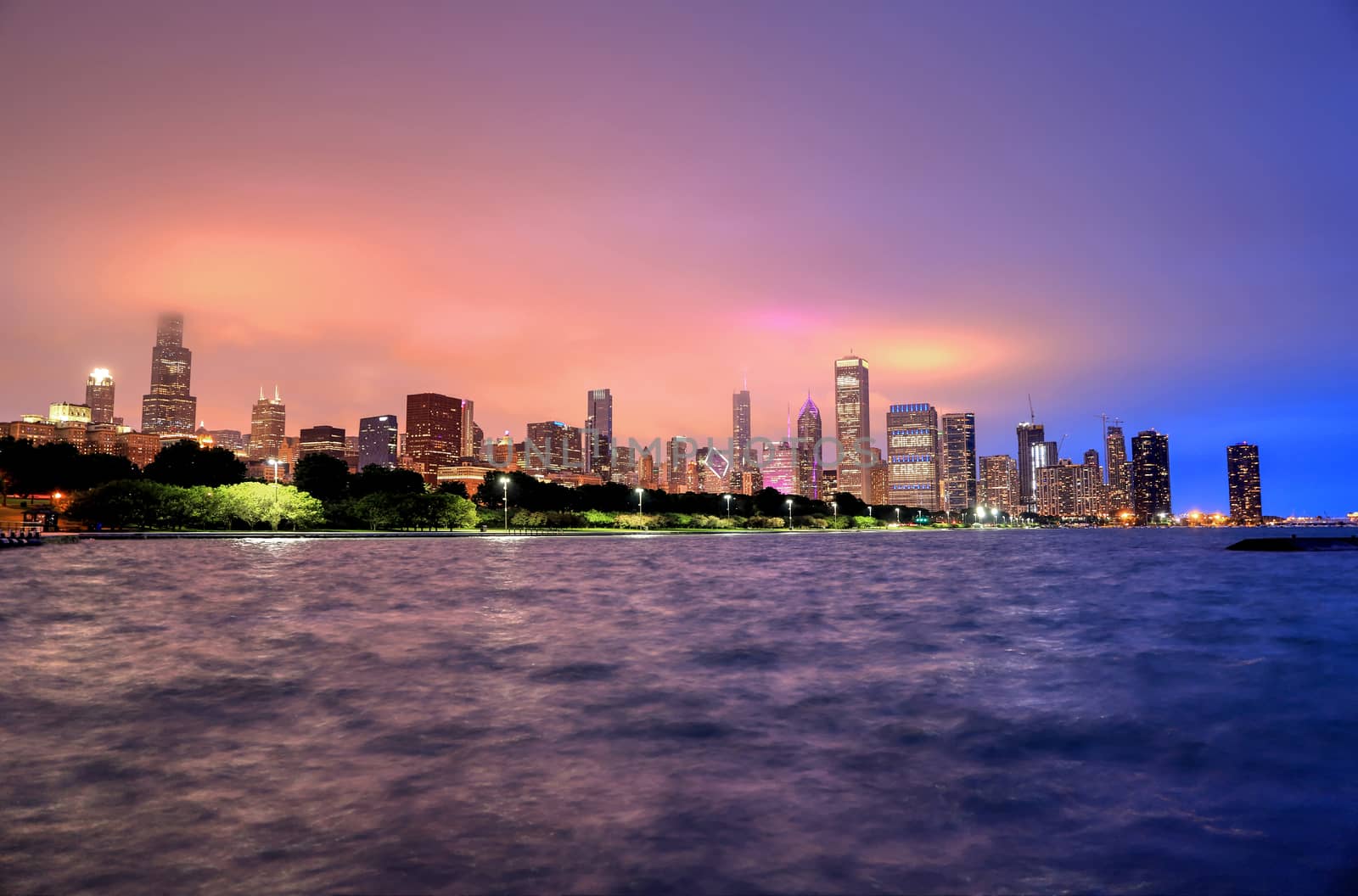 The Chicago skyline at night after a storm across Lake Michigan.
