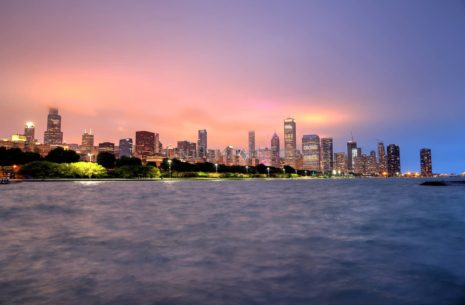 The Chicago skyline at night after a storm across Lake Michigan.