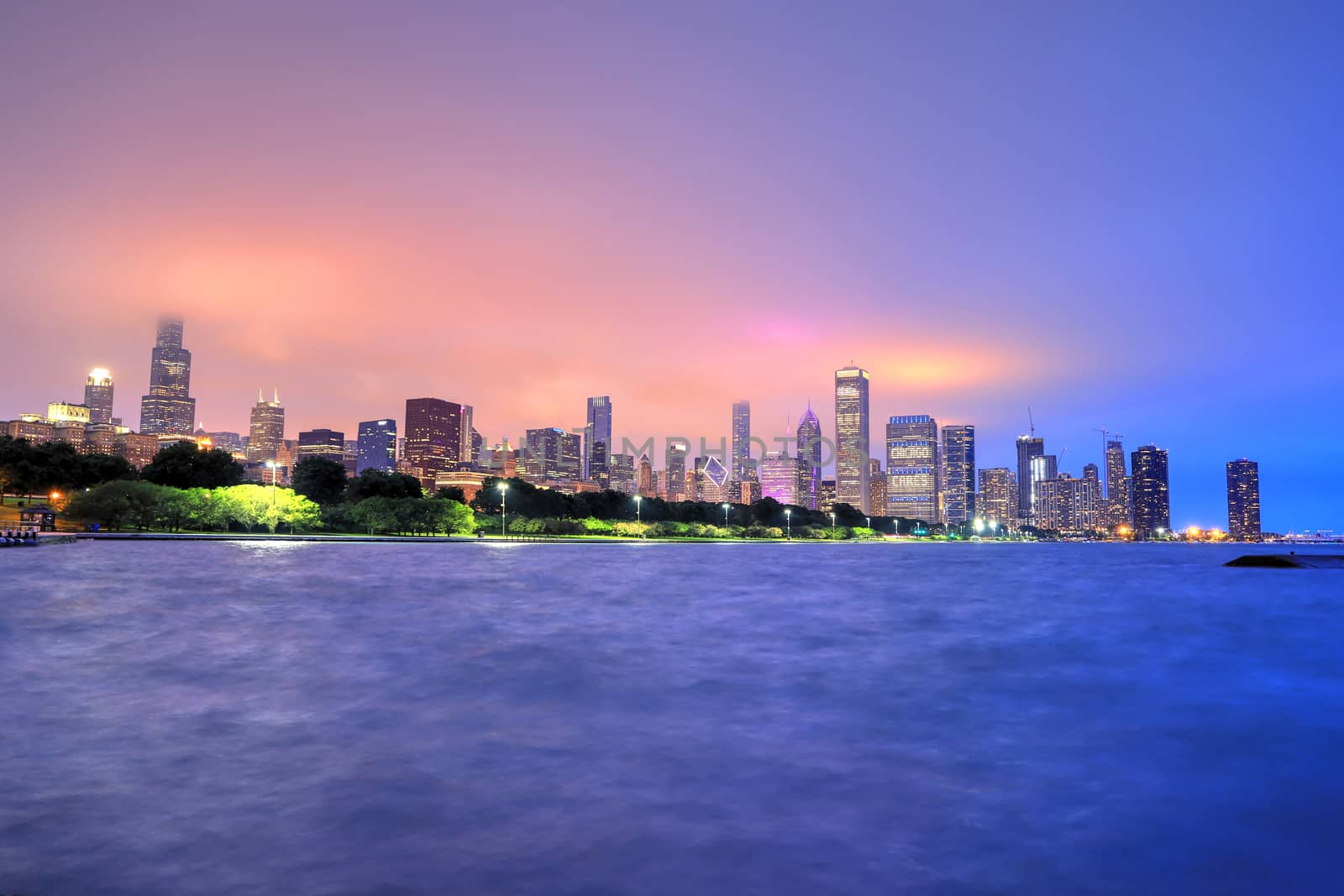 The Chicago skyline at night after a storm across Lake Michigan.