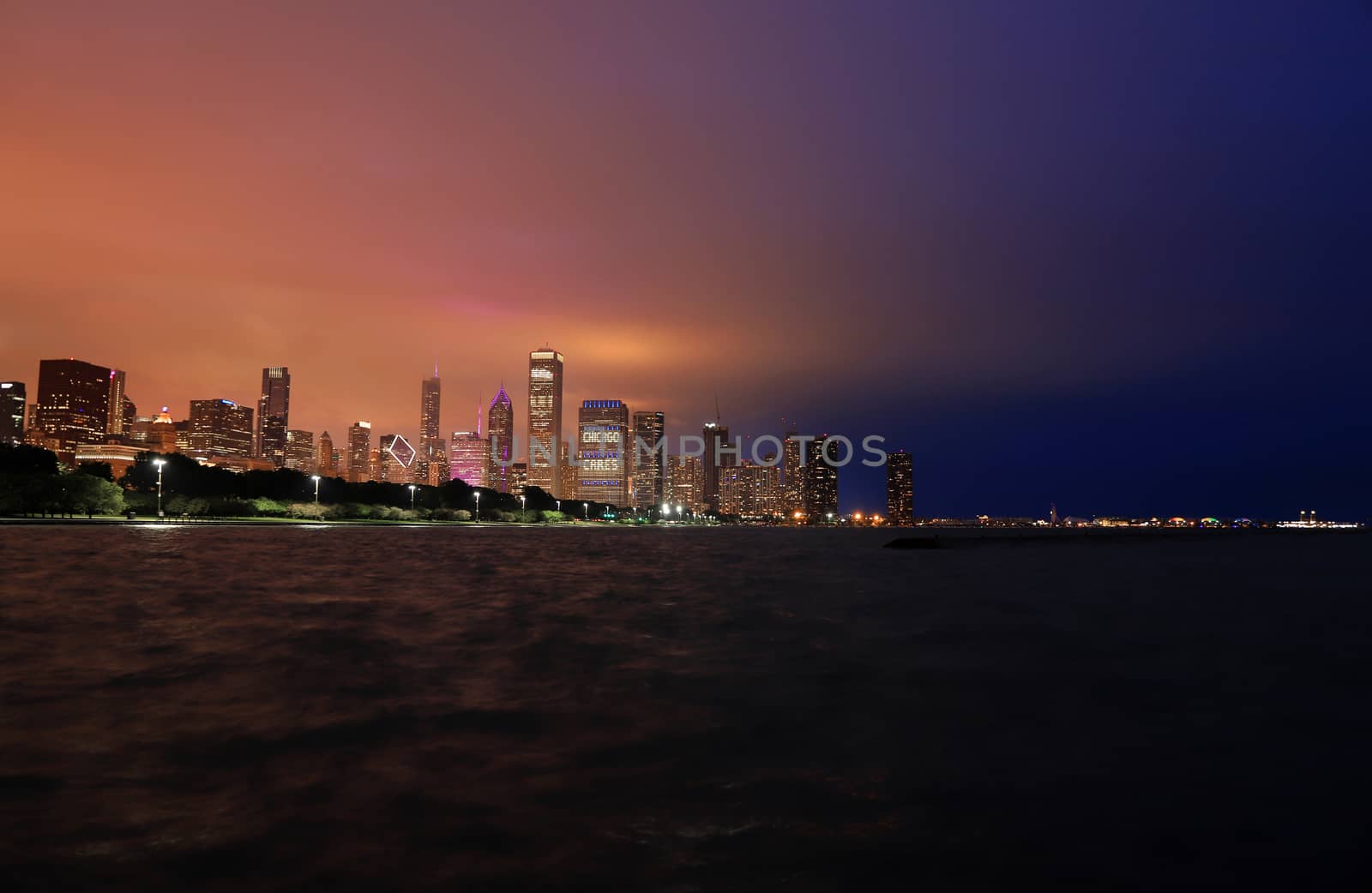 The Chicago skyline at night after a storm across Lake Michigan.