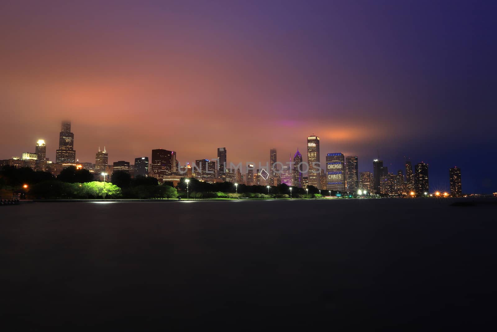 The Chicago skyline at night after a storm across Lake Michigan.