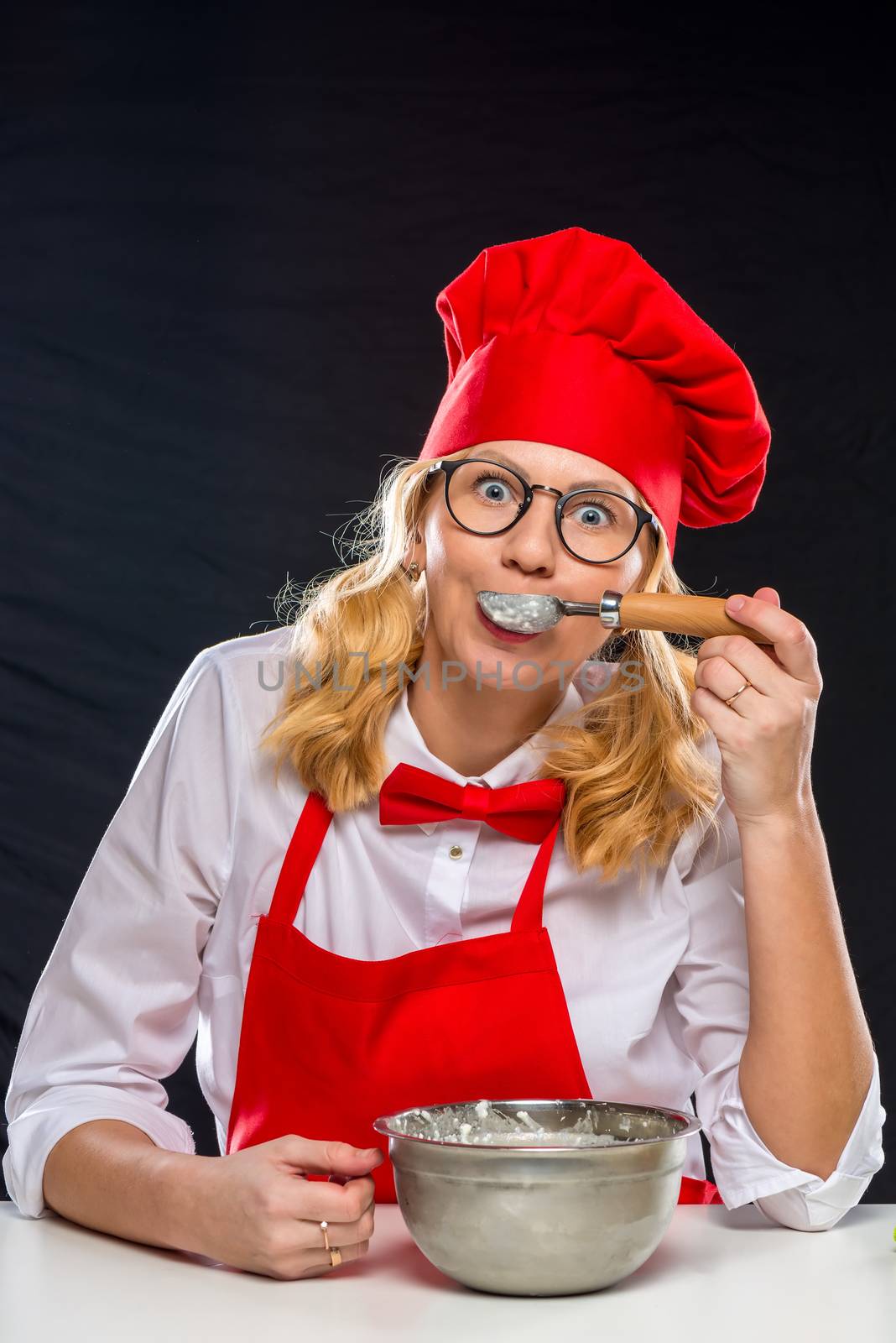 Portrait of a beautiful woman in a chef suit who cooks ice cream by kosmsos111