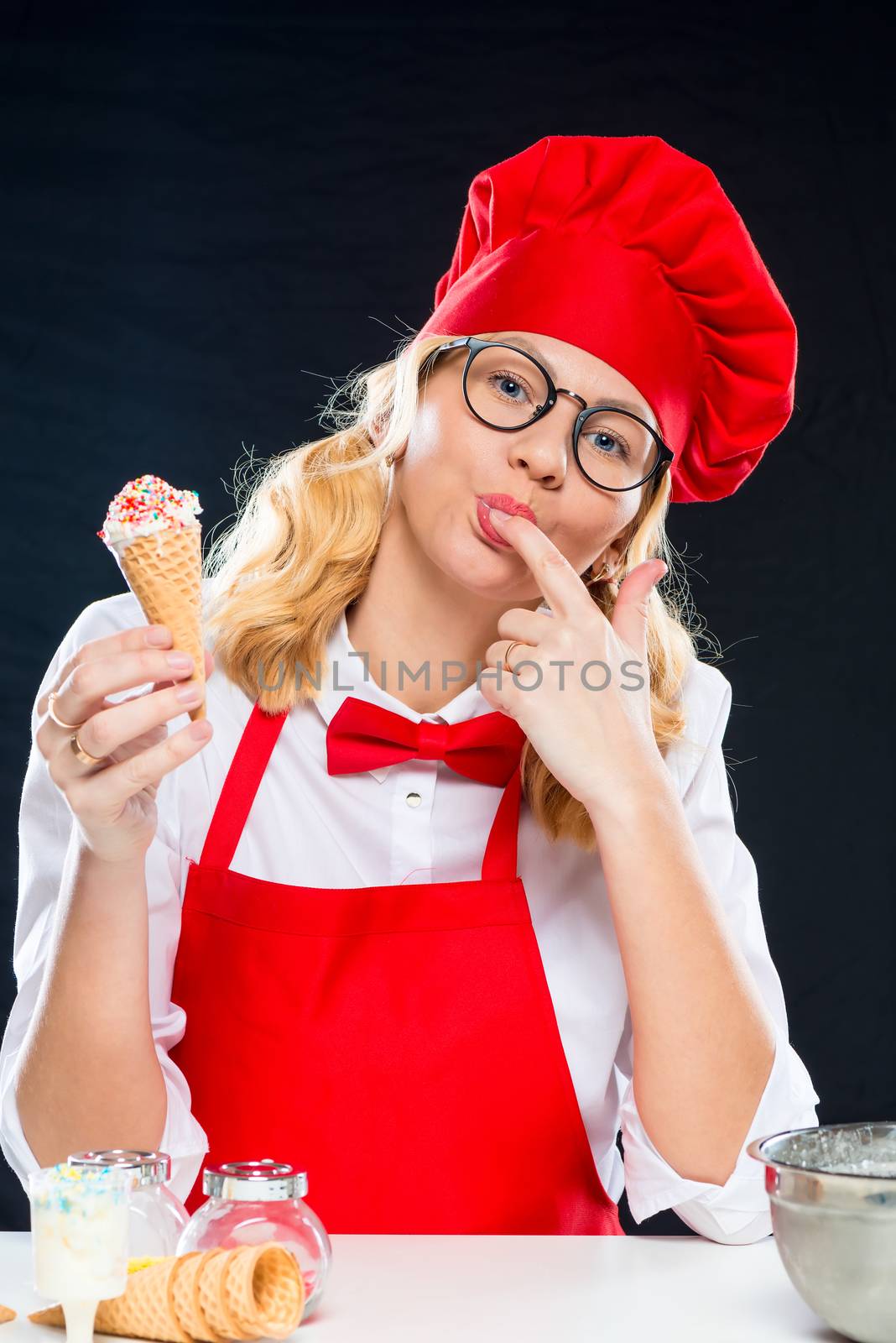 Portrait of a beautiful charming young chef with ice cream by kosmsos111