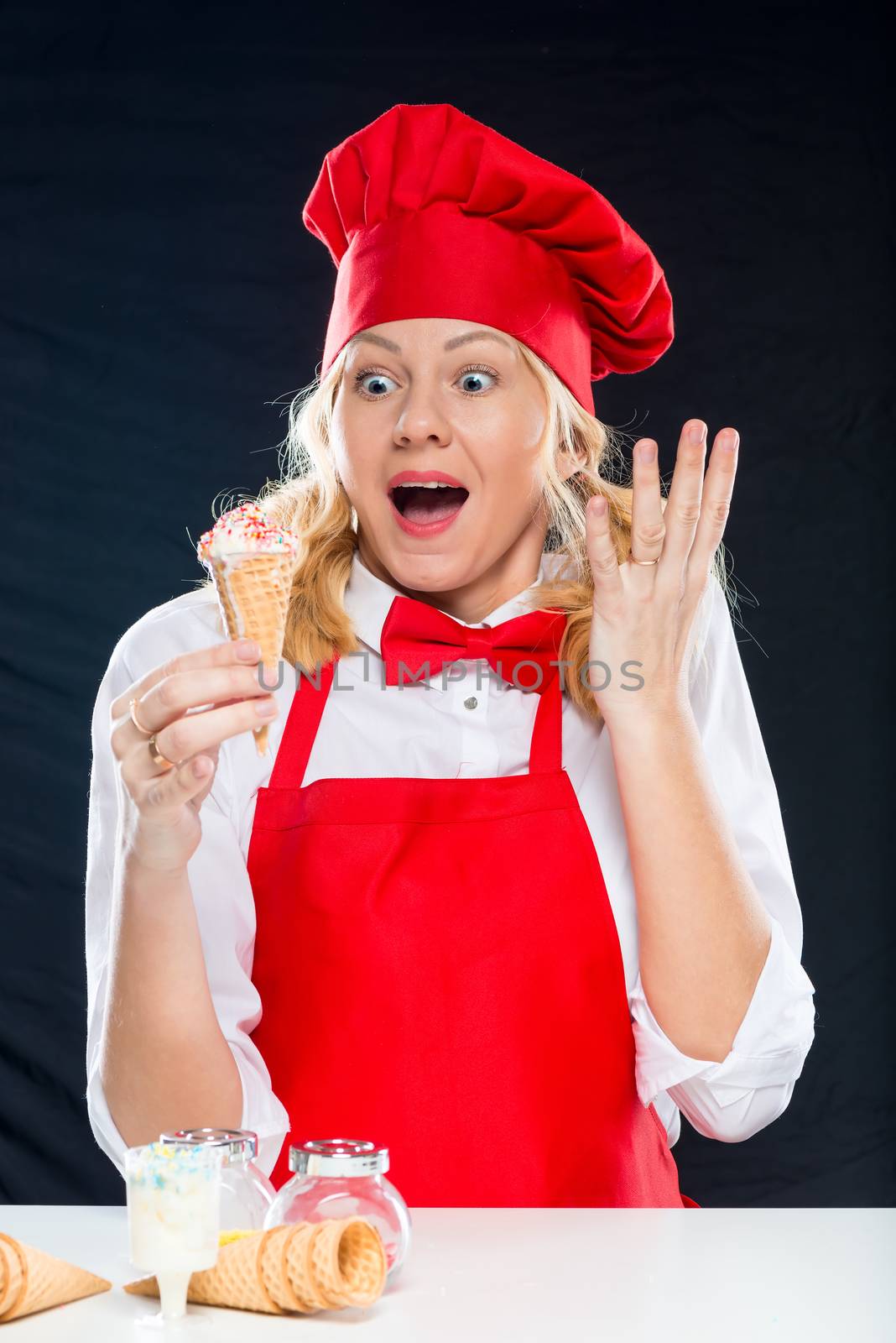 Portrait of a crazy and surprised chef with ice cream in a waffl by kosmsos111