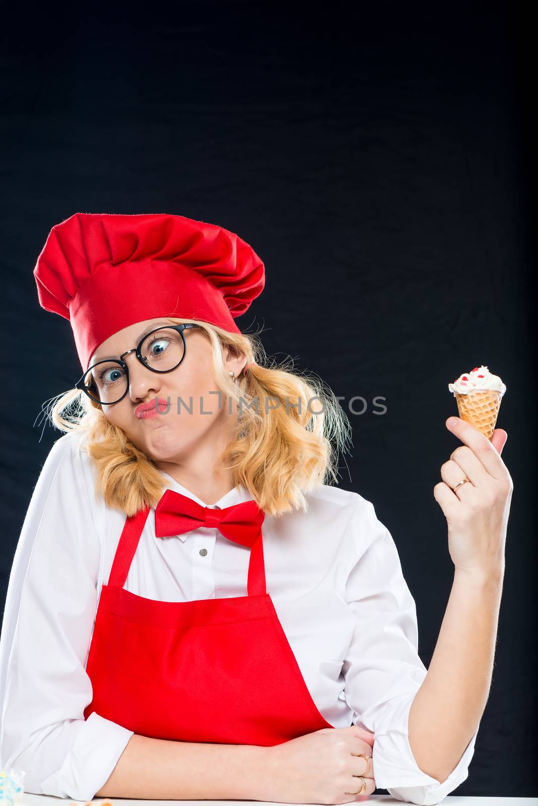 Woman with ice cream homemade grimaces on black background by kosmsos111