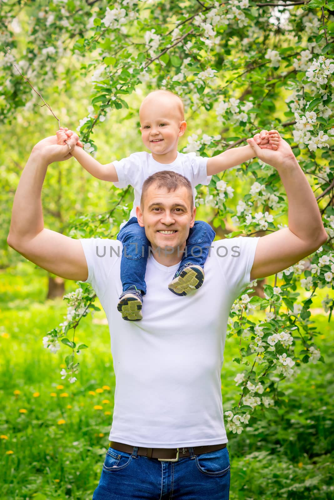 Happy father with his young son in the park for a walk