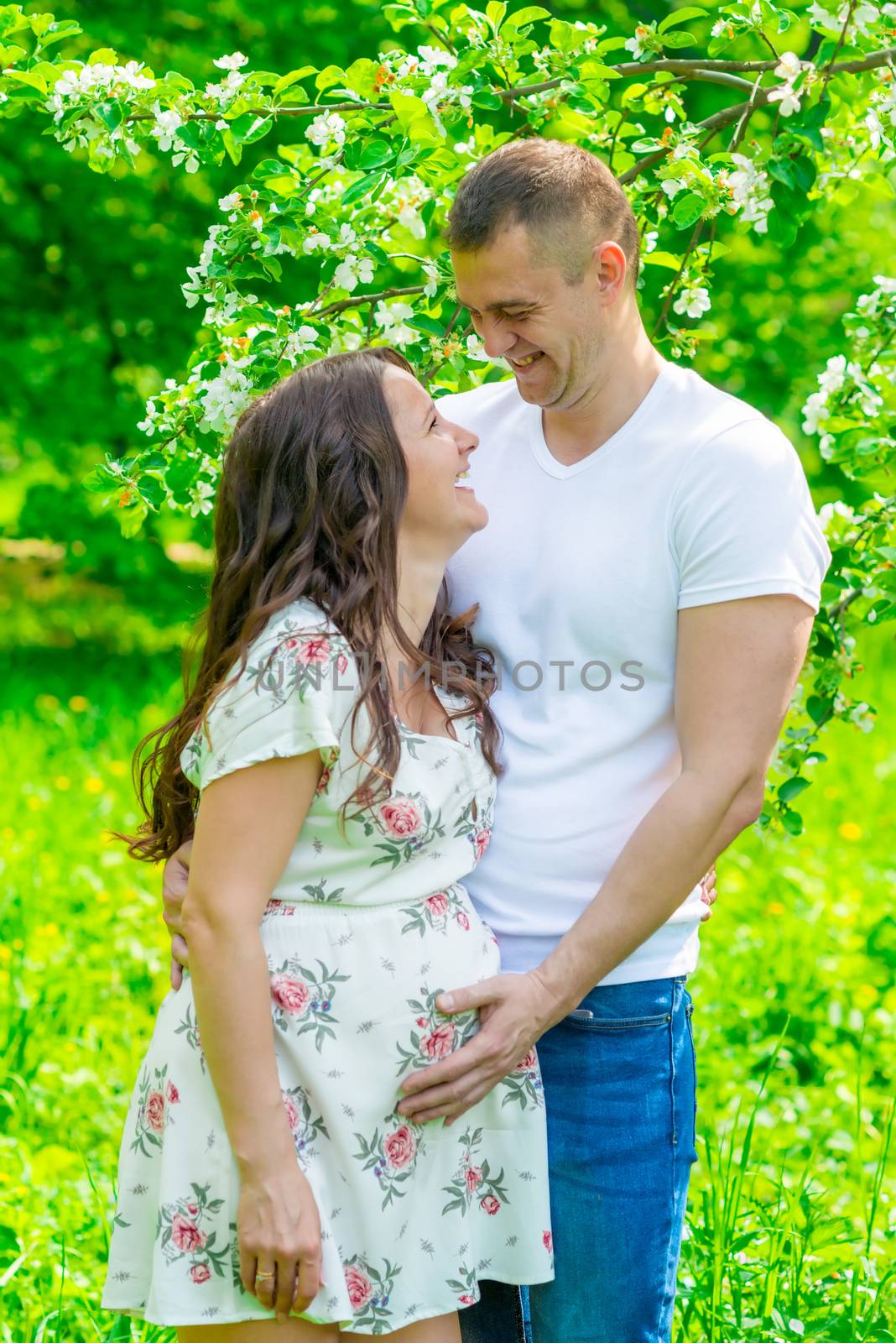 young married couple waiting for a child portrait in the park by kosmsos111