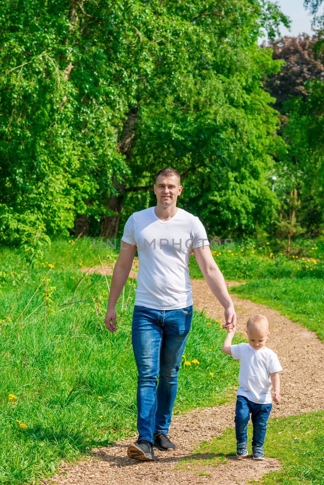 dad with his son for a walk in the park