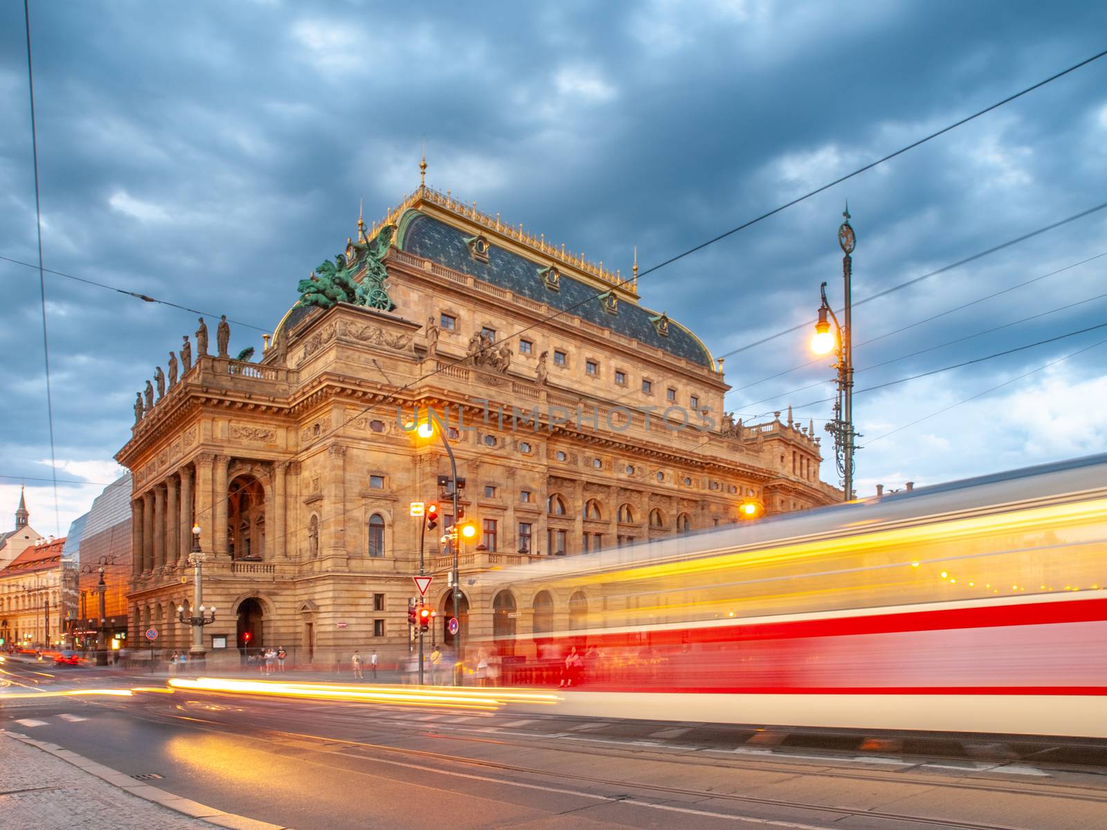 Evening at National Theater and blurred tram on the bridge, Prague, Czech Republic. Long exposure shot by pyty