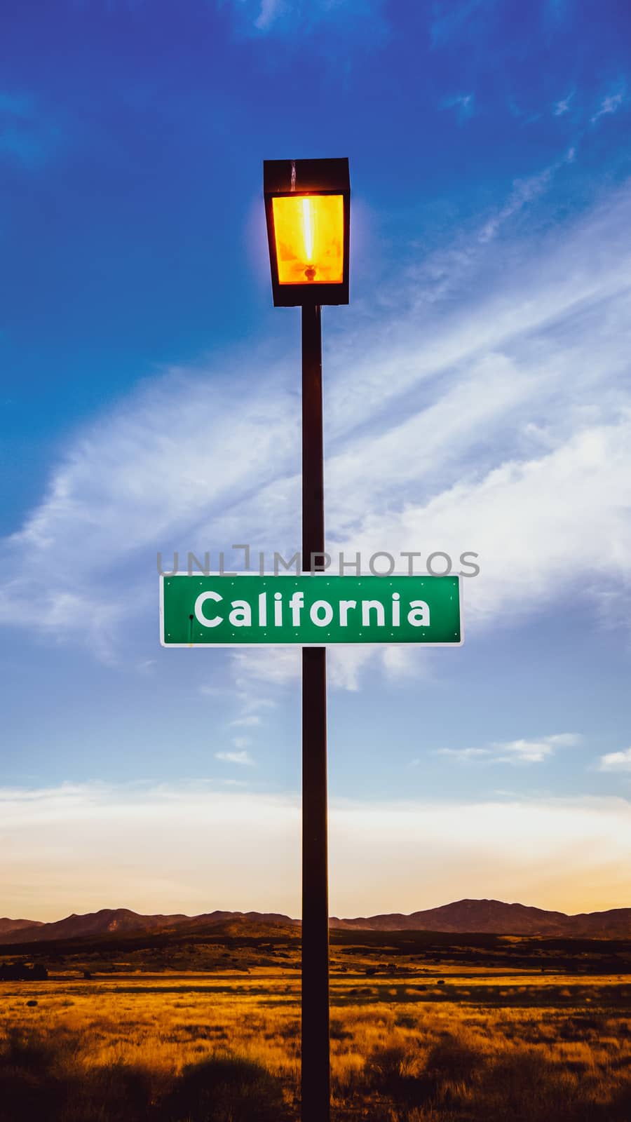 Retro Filtered Image Of A California Sign In The Mojave Desert At Dusk