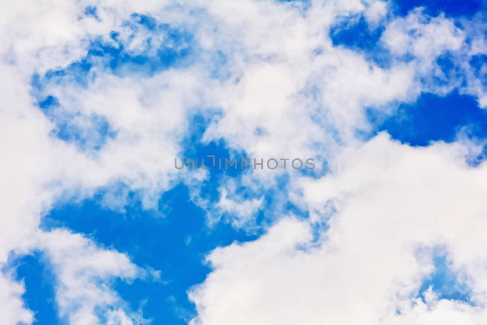 Blue sky with white clouds background.