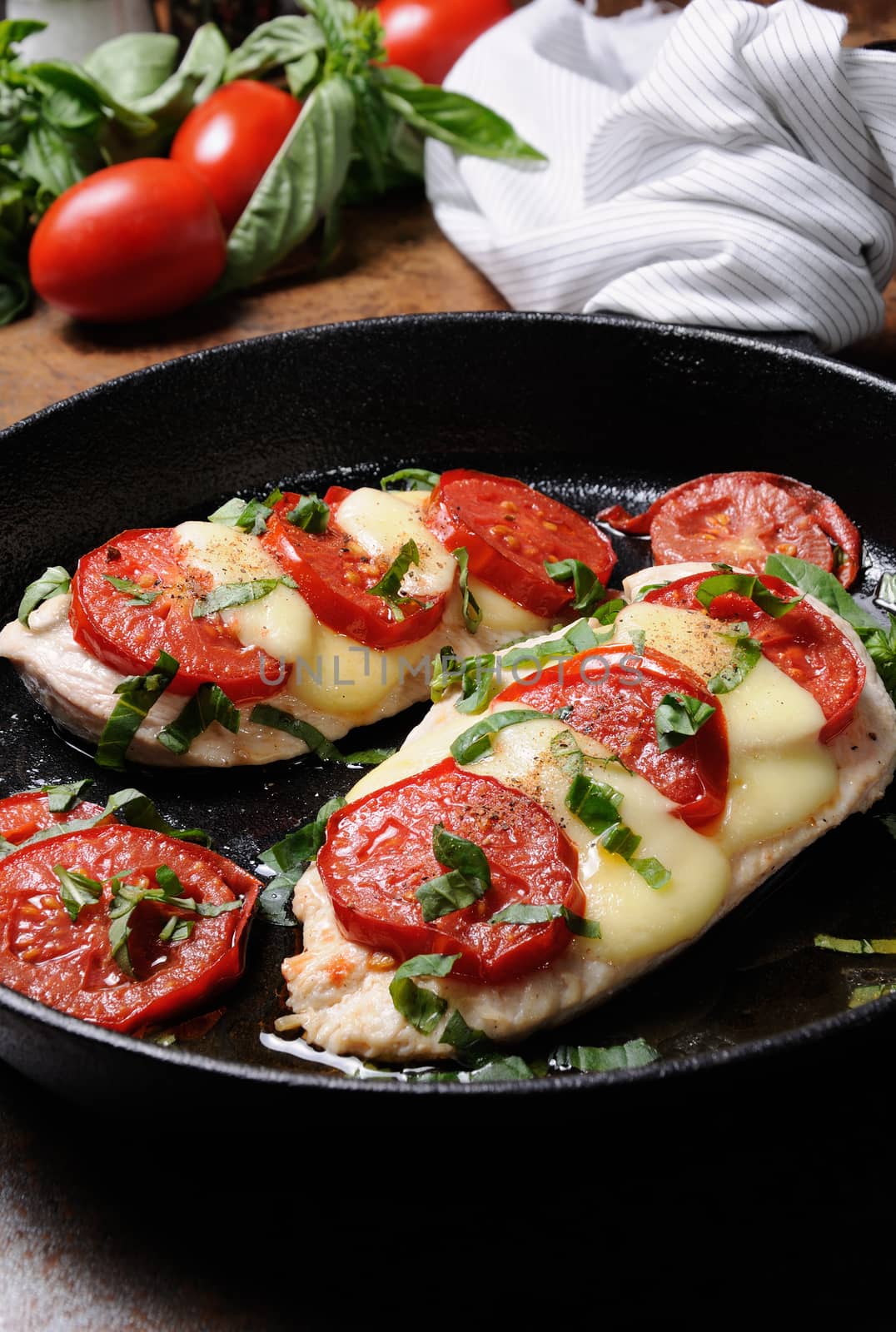 Langet from chicken breast with tomato and mozzarella. A-la caprese.
