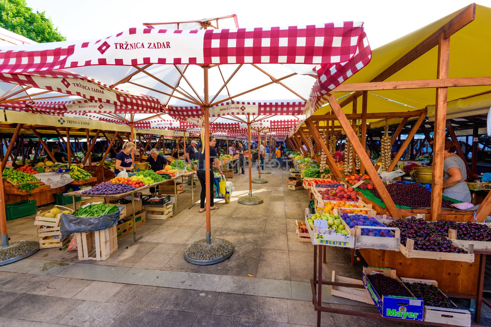 Zadar - July 3 2018: Local producers and merchants offering fresh local grown fruits and vegetables on the market. Due good climate conditions a variety of fresh products is available.