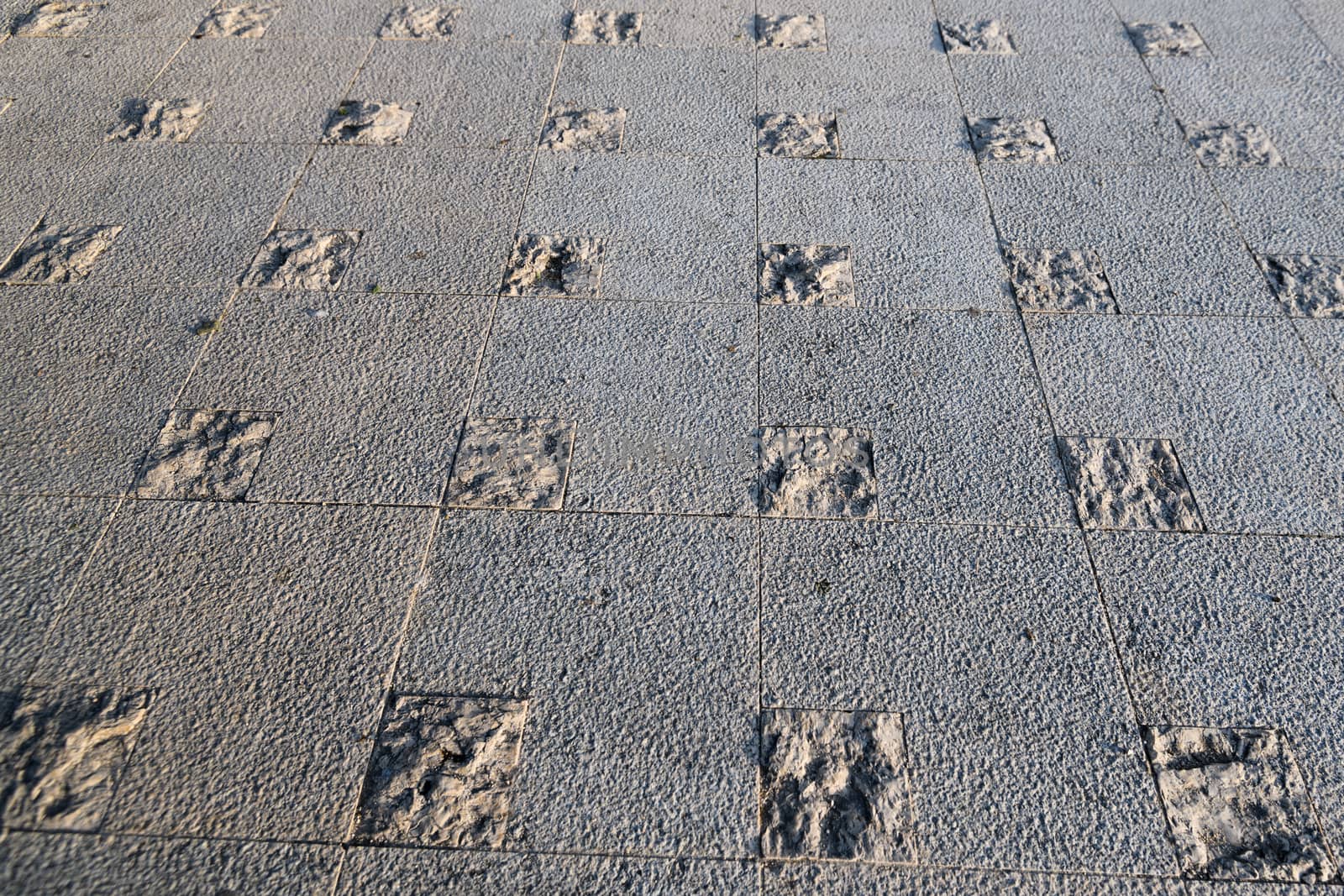 Abstract Stone Pavement, side illuminated texture on floor by asafaric