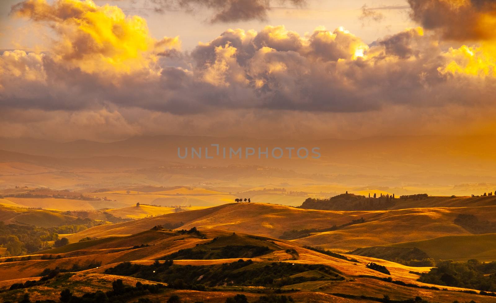 Evening with dramatic cloudscape in Tuscany, Italy.