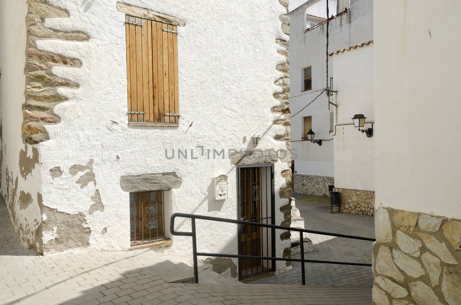 typical street of a village in Spain with white houses