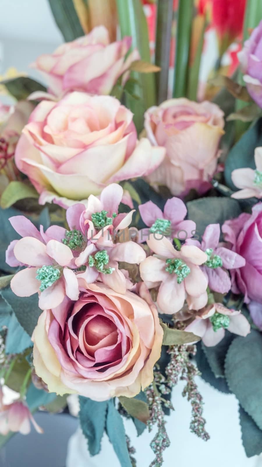 colorful of the plastic flowers bouquet , soft of focus