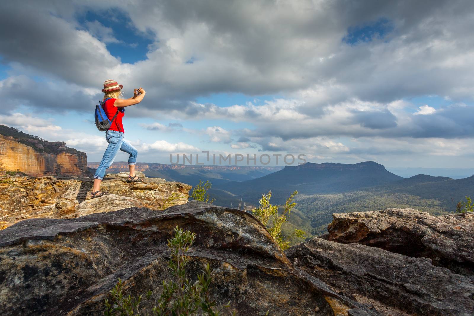 Tourist taking photos of stunning Blue Mountain vistas by lovleah