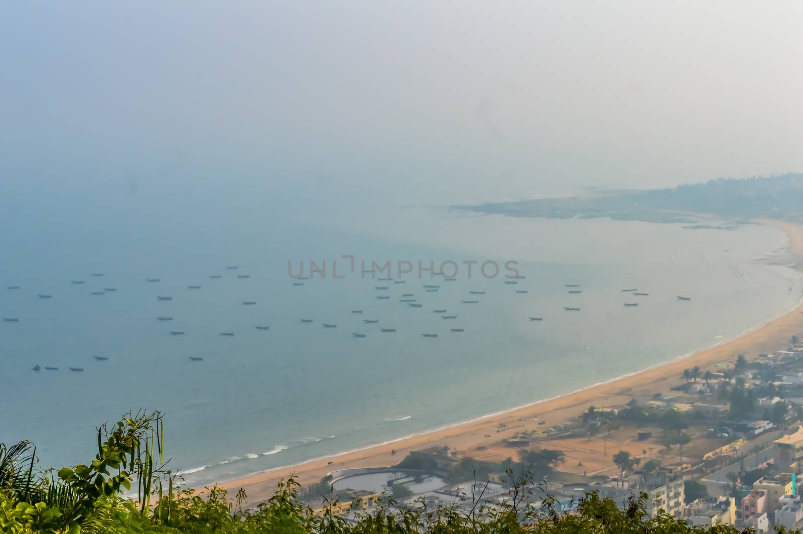 Photograph of Goa sea beach taken from top of a mountain during Christmas Holiday or New Year celebration time by sudiptabhowmick