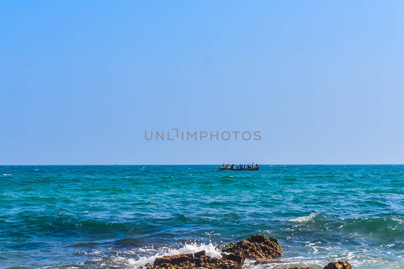 Photograph of Rowing Boat in Sea taken from a distance during Christmas Holiday or New Year celebration time in landscape style Use for background website banner usage Travel vacation holiday concept