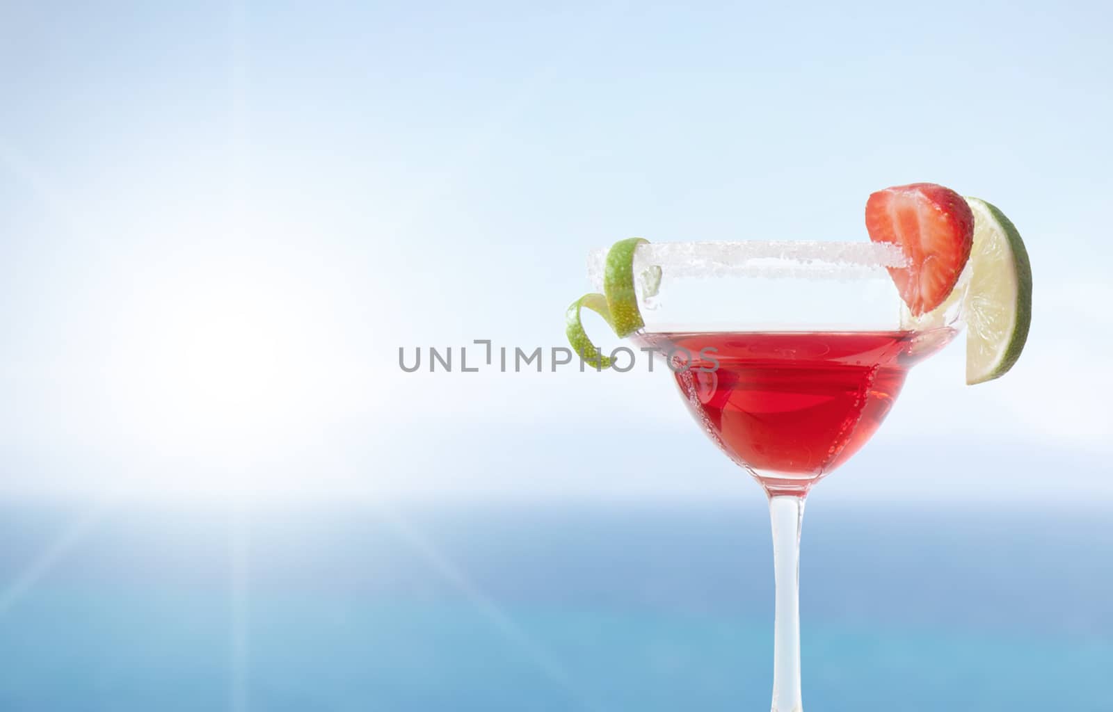 Red cocktail by the sea by unikpix
