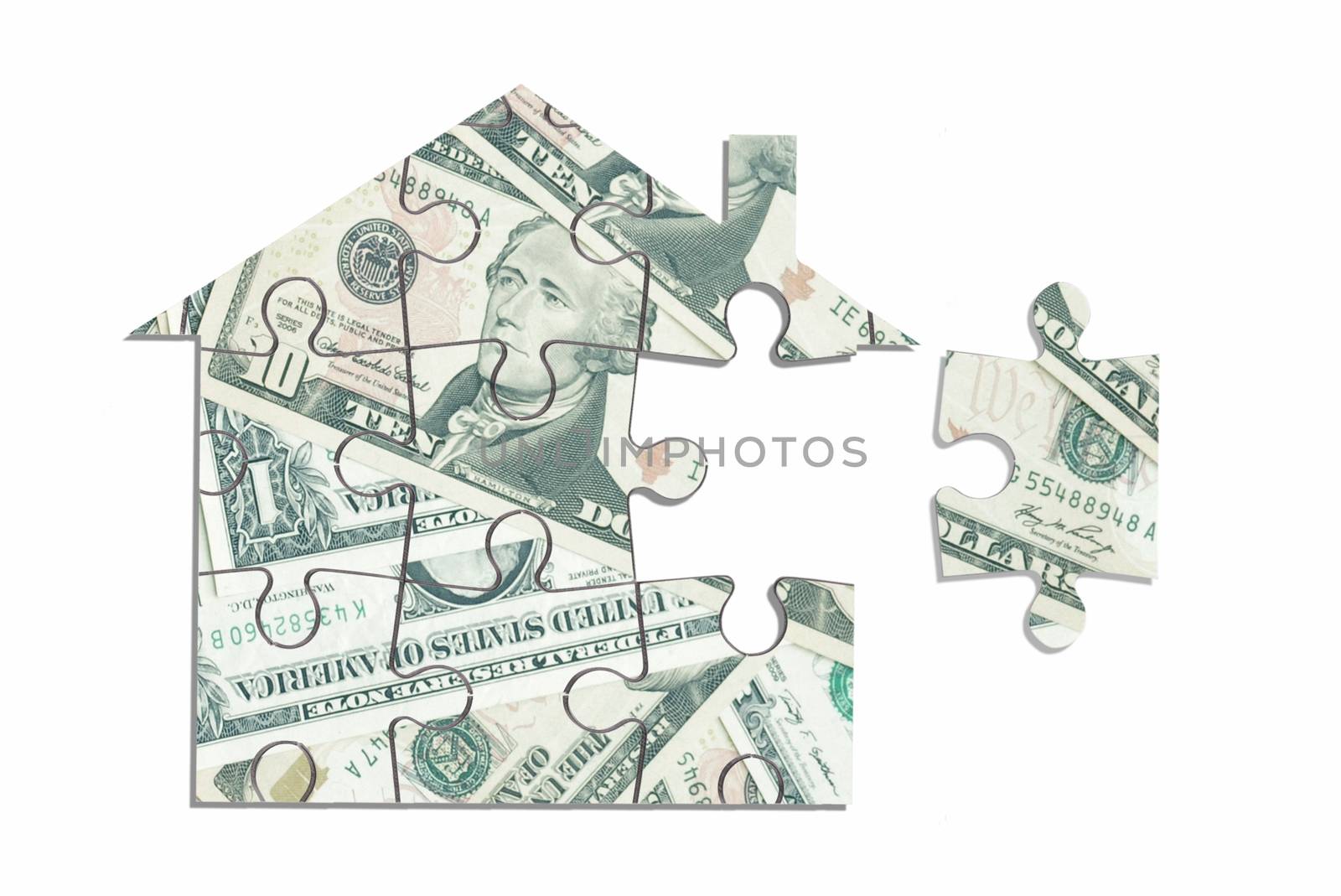 Dollar house jigsaw puzzle over a white background