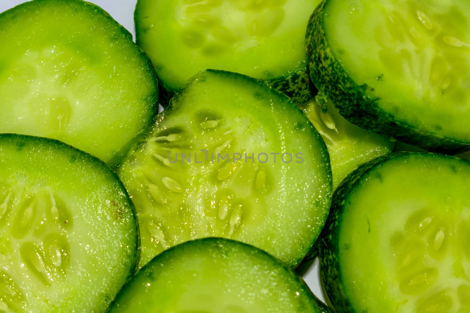 Cucumber and sliced background. by sudiptabhowmick