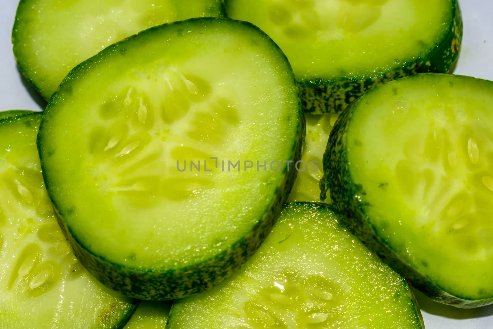 Cucumber and sliced background. by sudiptabhowmick