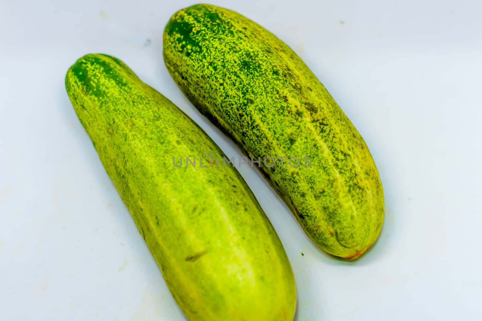 Cucumber isolated over white background. by sudiptabhowmick